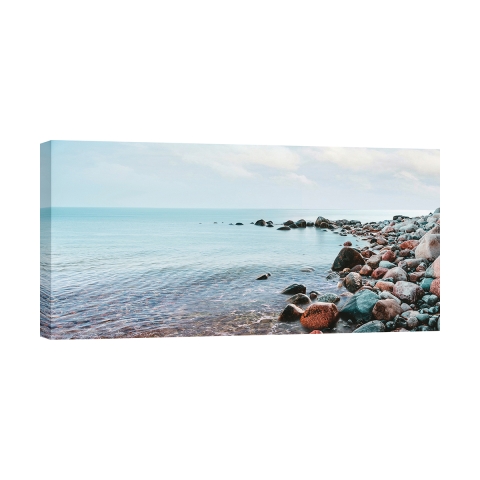 Leinwanddruck Meereslandschaft Kieselsteine am Strand Pangea Images Aktion